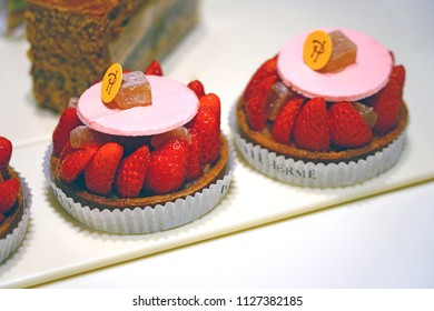 PARIS, FRANCE -28 JUN 2018- Display Of Colorful Gourmet French Pastries At Fashionable Pierre Herme Pastry Shop In Paris.