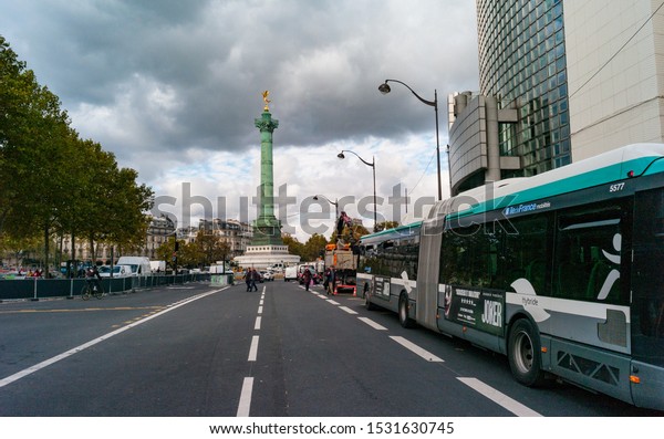 Paris, France - 3rd October,\
2019:  Bus stopped by Place de la Bastille and opera in central\
Paris