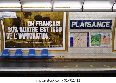 PARIS, FRANCE -8 JULY 2015- The Plaisance Station, On Line 13 Of The Paris Metro Subway, Is Located In The 14th Arrondissement. A Poster For An Exhibit About France And Immigration Is On The Platform.