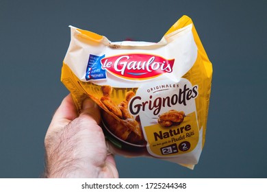 Paris, France - Apr 18, 2020: Male Hand POV Personal Perspective At The Package With Le Gaulois, Grignoter Chicken Meat Ready To Eat Just Preheat In Microwave