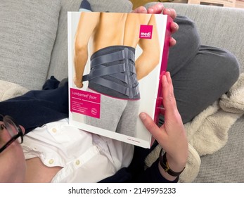 Paris, France - Apr 25, 2022: Woman Hand Looking At The Cardboard Box Package Of Lumbar Support For Relief Of The Facet Joints Lumbamed Facet Manufactured By Medi Germany