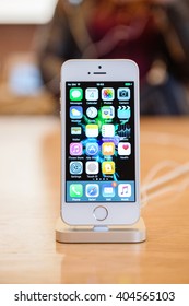 PARIS, FRANCE - APR 4, 2016: People Testing New IPhone With The Apple IPhone SE In Docking Station During The Sales Launch Of The Latest Apple Inc. Smartphone And IPad Pro At The Apple Store In Paris