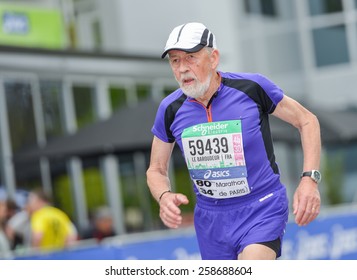 PARIS, FRANCE - APRIL  06 : Old Marathon Runner Finishing Line At Paris International Marathon On April 06, 2014 In Paris, France