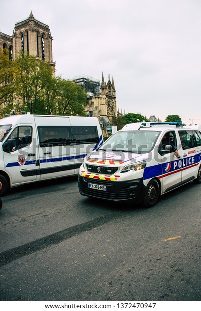 Paris France April 16, 2019 View of a French
police car near the Notre Dame cathedral in Paris the day after the
big fire in the afternoon