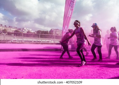 PARIS, FRANCE - APRIL 17: crowds of unidentified people at the Color Run on April 17, 2016 in Paris, France. The Color Run is an event worldwide fun race where runners are showered with colored powder