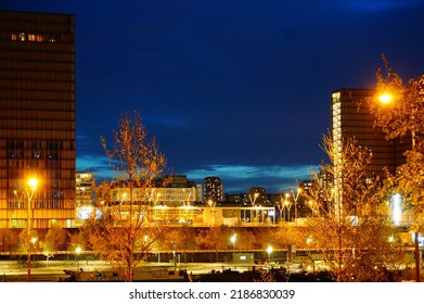 Paris, France - April 2022 -  Night View In The Dark Of The Illuminated Towers Of François Mitterrand French National Library (BNF), On Quai Mauriac, In The Neighborhood Of Bercy (12th Arrondissement)