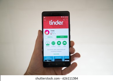 Paris, France, april 22, 2017: Tinder application on google play store on smartphone