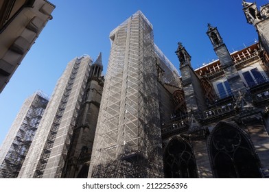 Paris, France - April 24, 2021 - Reconstruction site of the medieval Notre-Dame Cathedral, damaged by a fire in 2019 : here, the nave of the gothic building is flanked with huge scaffoldings