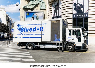 PARIS, FRANCE - AUG 18, 2014: Shred-it Truck Shredder Outside Client's Door On Paris Street. Shred-it Specializes In Mobile On-site And Off-site Secure Paper Shredding And Confidential Waste Disposal