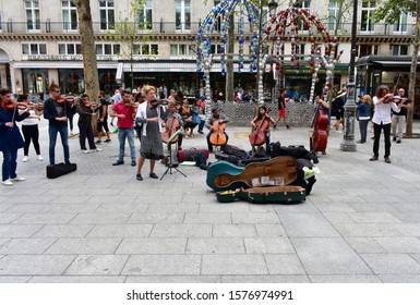 Paris, France. August 16, 2019. Small Orchestra Playing On The Street.