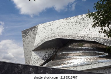 Paris, France - August 24, 2022: Paris Philharmonic. Huge Aluminum Building And Shiny Stainless Steel Facades In The Parc De La Villette
