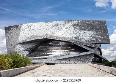 Paris, France - August 24, 2022: Paris Philharmonic. Huge Aluminum Building And Shiny Stainless Steel Facades In The Parc De La Villette
