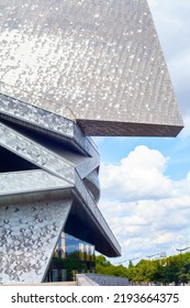 Paris, France - August 24, 2022: Paris Philharmonic. Huge Aluminum Building And Shiny Stainless Steel Facades In The Parc De La Villette.
