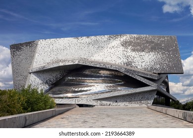 Paris, France - August 24, 2022: Paris Philharmonic. Huge Aluminum Building And Shiny Stainless Steel Facades In The Parc De La Villette.
