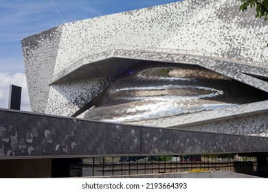 Paris, France - August 24, 2022: Paris Philharmonic. Huge Aluminum Building And Shiny Stainless Steel Facades In The Parc De La Villette.
