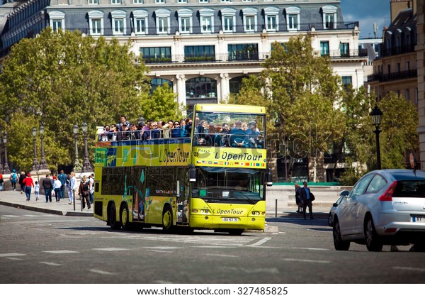 PARIS, FRANCE - AUGUST 27, 2011:\
Yellow city sightseeing bus Neoplan on Paris city\
street.