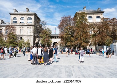 Paris, France - August 27 2022: Buildings On The Square Near Notre Dame De Paris. People Taking Photos Of The Buildings And Themselves, Selective Focus