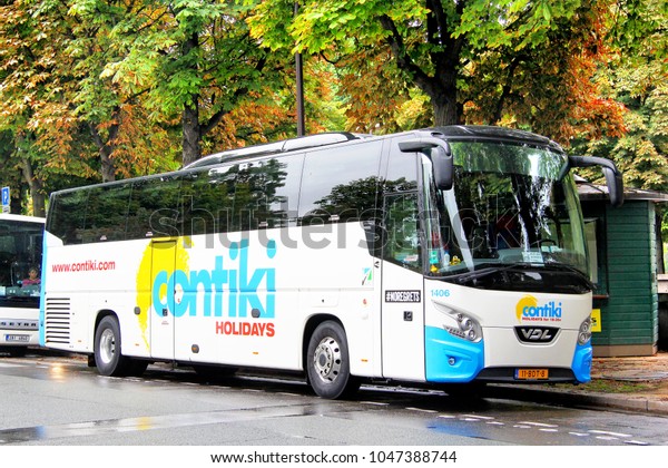 Paris, France - August 8, 2014: Touristic coach\
bus VDL Futura in the city\
street.