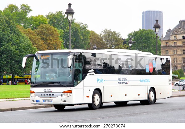 PARIS, FRANCE - AUGUST 8, 2014: White
interurban coach Setra S416GT at the city
street.