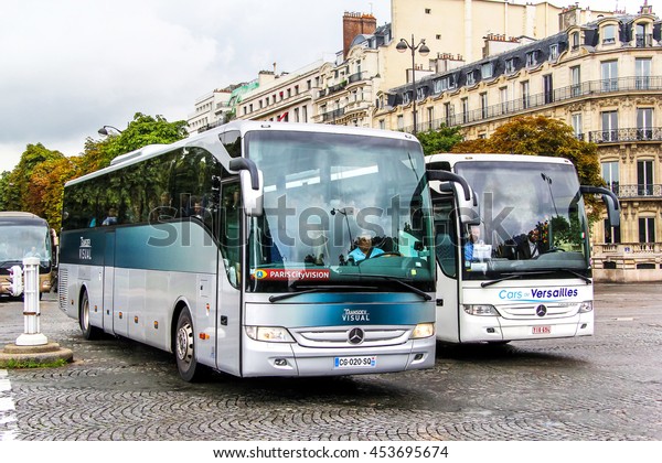 PARIS, FRANCE - AUGUST\
8, 2014: City sightseeing coach buses Mercedes-Benz O350 Tourismo\
in the city street.