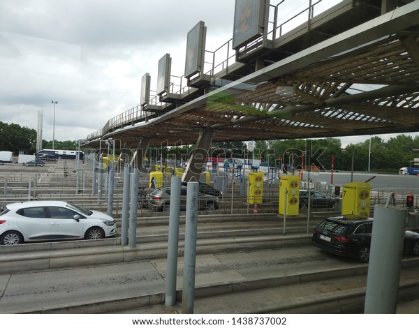 Paris, France - Brussels, Belgium\
- June 2019: Toll road. Cars on a toll highway near\
Brussels.