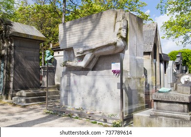 Paris, France, Circa May 2017. The grave of writer Oscar Wilde in Pere Lachaise cemetery covered in kisses. 