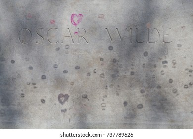 Paris, France, Circa May 2017. The grave of writer Oscar Wilde in Pere Lachaise cemetery covered in kisses. 