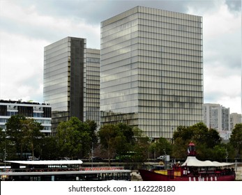 Paris, France, Date 13.8.2018, Time 12 O'clock And 9, View Direction To The Southeast And Northeast Buildings Of The Bibliothèque Nationale De France (site François-Mitterrand), Foreground Shore Seine