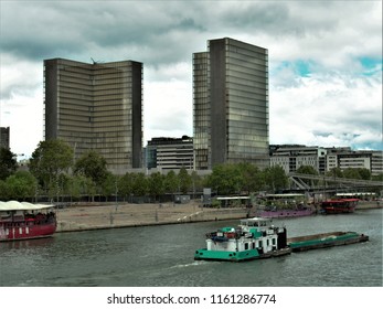 Paris, France, Date 8.13.2018, Time 12 O'clock 9 Minutes, River Seine Shore With View In Southwest Direction To The Buildings Of The Bibliothèque Nationale De France (site François-Mitterrand)