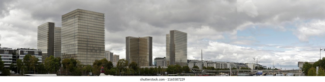 Paris, France, Date 8.13.2018, Time 12 O'clock And 7 , Panoramic View   To The Four Buildings Of The Bibliothèque Nationale De France (site François-Mitterrand), In The Foreground Shore River Seine