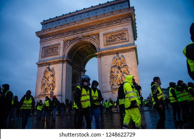 Paris, France - December 01, 2018 : The Gilets Jaunes, Or “Yellow Vest”, Protestors Clash With Police While Demonstrating Against The Government Of President Macron Near The Arc De Triomphe.