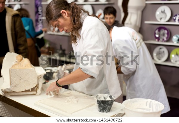 Paris, France - December 4, 2010:
Artist making a plaster cut.