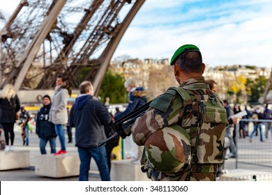 Paris, France - December 5, 2015: French Soldier Guarding The Eiffel Tower To Prevent Terrorism.