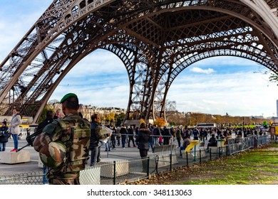 Paris, France - December 5, 2015: French Soldier Guarding The Eiffel Tower To Prevent Terrorism.