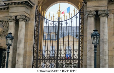 Paris, France - Entrance Gate Of The Élysée Palace, Seat Of The Presidency Of The French Republic And Residence Of The French Head Of The State, Adorned With French Flags