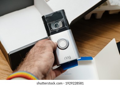 Paris, France - Feb 21, 2021: POV Male Hand Holding New Latest Amazon Ring Video Doorbell 3 With Enhanced Security For Your Home