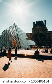 Paris / France - February 16 2019: Le Louvre Pyramid During The Daytime, With Blue Skies