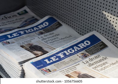 PARIS, FRANCE - February 27, 2018: Le Figaro Newspaper Stacks  At Charles De Gaulle Airport 