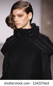 PARIS, FRANCE - FEBRUARY 29: A model walks the runway during the Atsuro Tayama Ready to Wear Fall/Winter 2011 show as part of the Paris Fashion Week on February 29, 2012 in Paris, France - Shutterstock ID 124237663