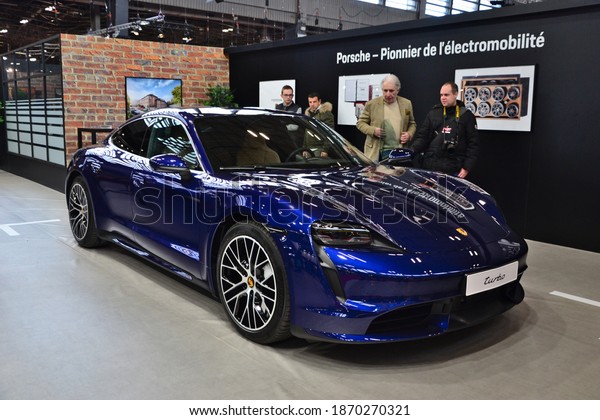 Paris, France - February 4th 2020 :
Retromobile 2020. Focus on a blue Porsche taycan turbo. This model
is the first one of Porsche to be 100%
electric.