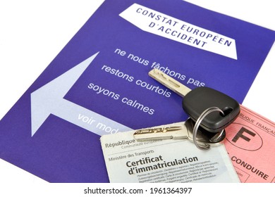 Paris, France - February 6, 2012: European Accident Report Official Document In French With Car Key, Driver's License And Gray Card, On White Background