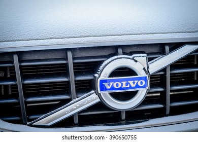 PARIS, FRANCE - JAN 20, 2016: Volvo Cars logotype covered with snow flakeson car front. Volvo is the only car maker that thas the biggest 5 star NCAP test results