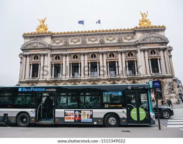 Paris, France -\
Jan 20, 2019: Paris National Opera in central square with urban\
public transportation bus number\
53