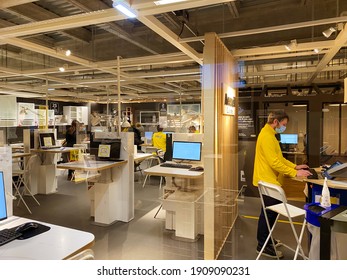 Paris, France - Jan 20, 2021: Single Worker With No Customers Inside Furniture Store IKEA During COVID 19 Coronavirus Worldwide Pandemic Situation