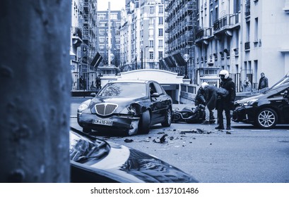 PARIS, FRANCE - JAN 30, 2018: People Helping Accident On Paris Street Between Luxury Limousine Lancia Thesis And Scooter Moped - Rue De Courcelles - Blue Color Cast