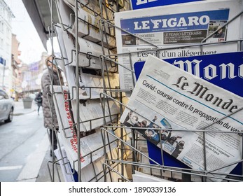 Paris, France - Jan 7, 2020: French Newspaper Le Monde On Press Kiosk Market Stall With Headlines COVID Coronavirus New Mutation Exapnds - City Background