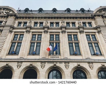 PARIS, FRANCE - JANUARY, 1, 2019: Facade Of Sorbonne University With France And European Union Flags. Name Is Derived From College De Sorbonne (1257) By Robert De Sorbon.