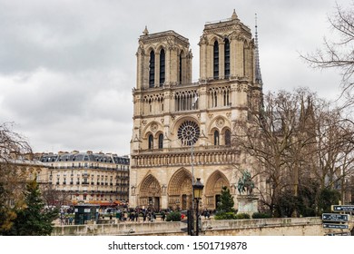 Paris, France - January 28, 2018: Front architectural view of the facade of Notre Dame cathedral.