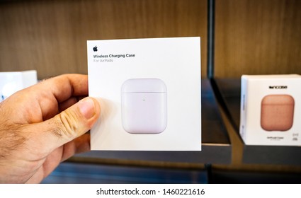 Paris, France - Jul 24, 2019: Man POV Personal Perspective Inside Apple Store At The New Wireless Charging Case For AirPods