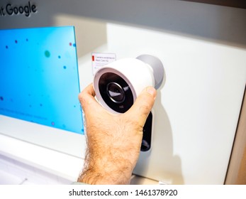 Paris, France - Jul 25, 2019: Man Hand Looking At The Nest Cam IQ On Wall New Premium Model Of Nest Cam Indoor. It Features A 4K Camera Sensor With HDR